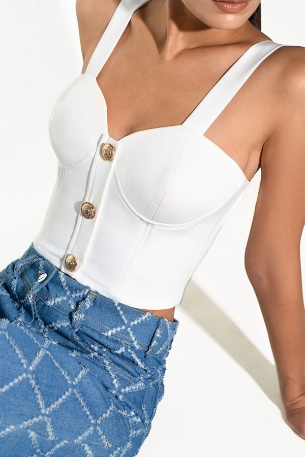 Solenne Corset Top in white with structured cups and gold button detailing