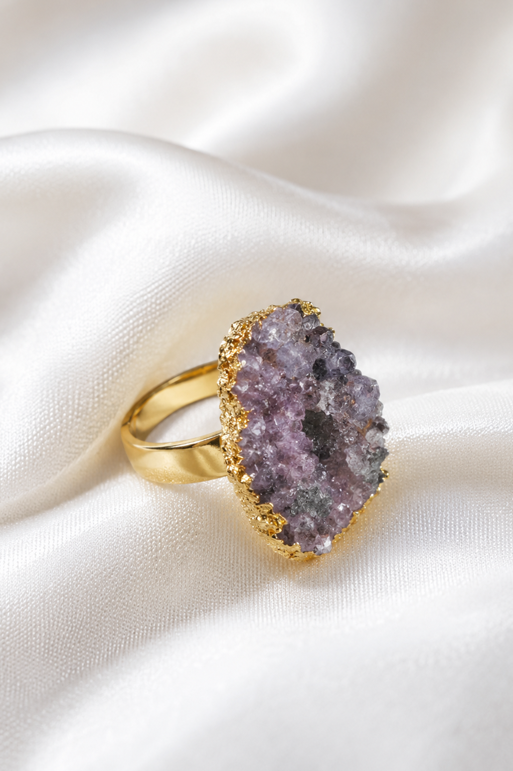 Gold Druzy Statement Ring displayed on white satin