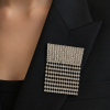 Avelune Crystal Fringe Brooch styled on a black blazer
