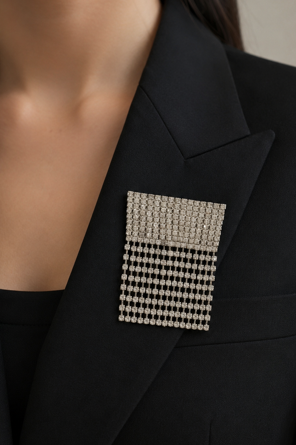 Avelune Crystal Fringe Brooch styled on a black blazer