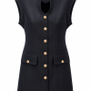 Black structured mini dress with gold-button flap pockets