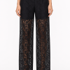 Luxury black wide leg lace trousers with floral lace design.