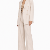 Elvaria Tailored Blazer 2 Discover the Elvaria Double-Breasted Tailored Blazer, featuring refined tailoring, an elegant ivory tone, and a timeless silhouette for luxury styling.