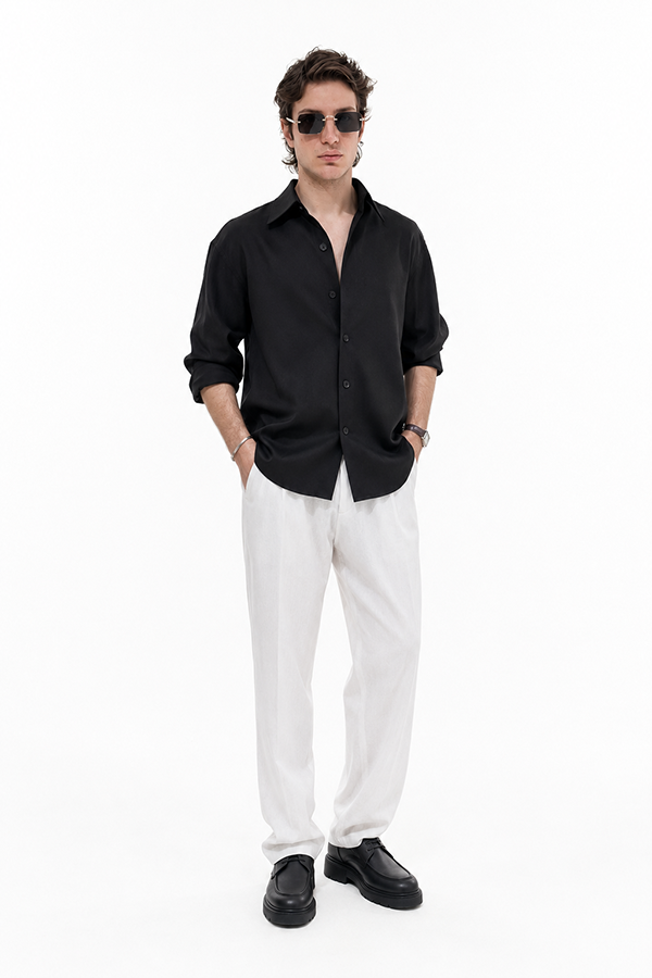 Leander Textured Black Shirt styled with white tailored trousers
