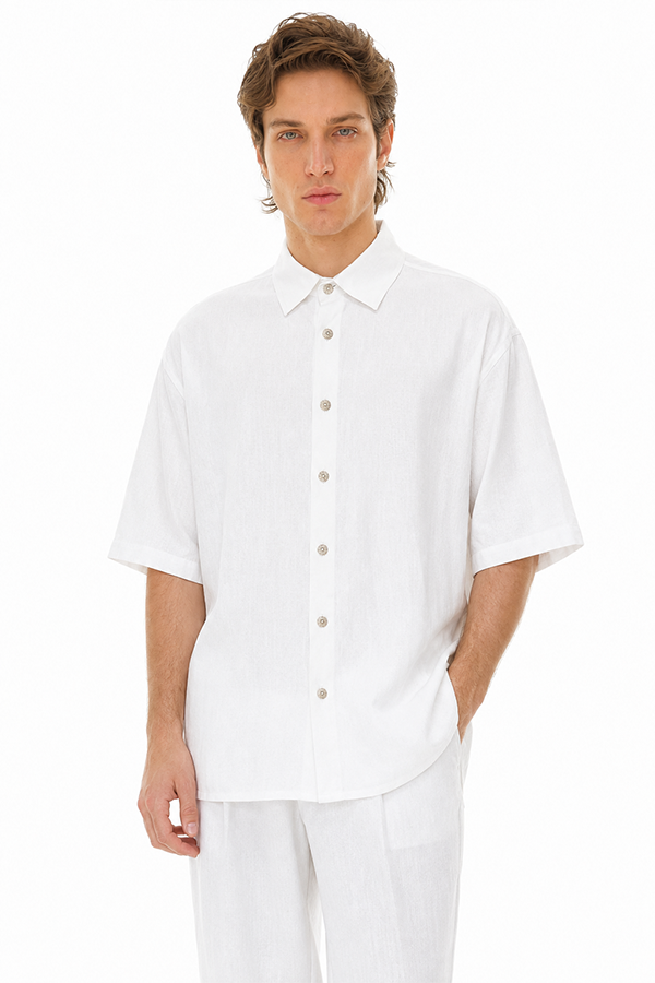 Pureform White Linen Shirt styled with matching white linen trousers on a male model