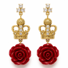 Gold crown and red rose drop earrings on white background