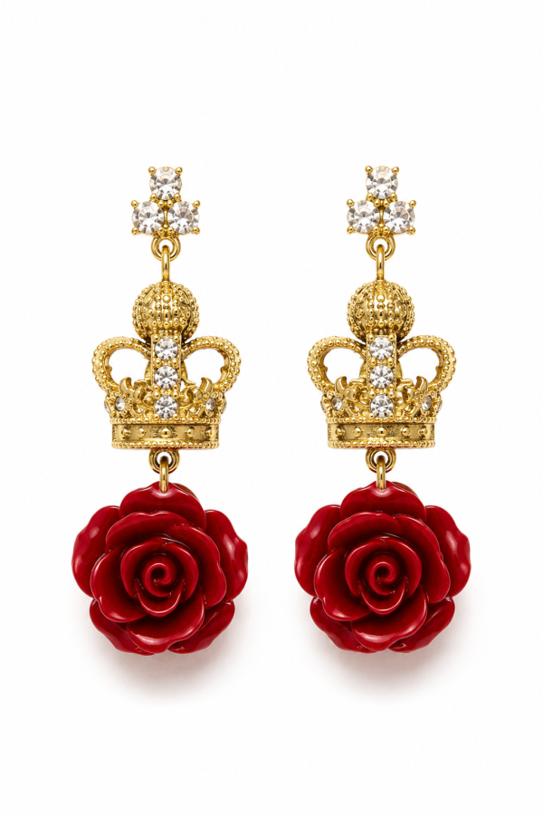 Gold crown and red rose drop earrings on white background