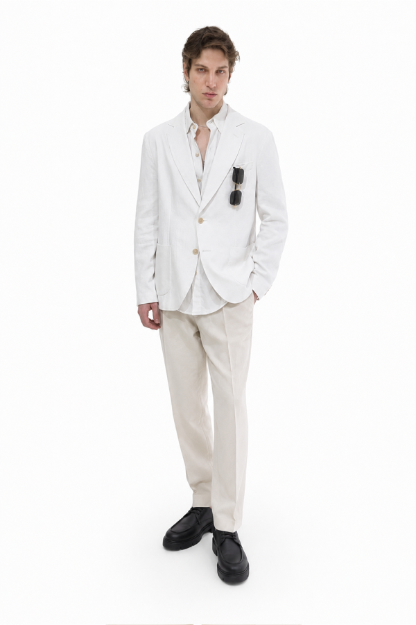 A lightweight white Patch-Pocket Linen Blazer featuring a two-button front, classic notch lapels, rounded patch pockets and a softly curved hem. The Marcell Linen Blazer combines breathable summer comfort with relaxed, contemporary tailoring.