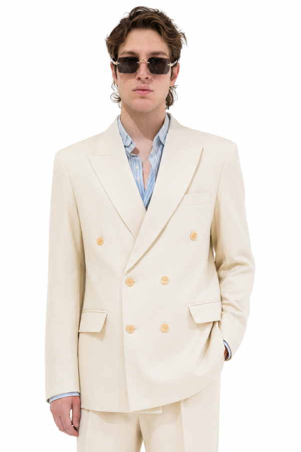 The Regent Double-Breasted Blazer features premium Cartier cotton, wide peak lapels, structured shoulders and a relaxed six-button silhouette.