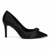 Velmora embellished pumps styled with a long black slit dress