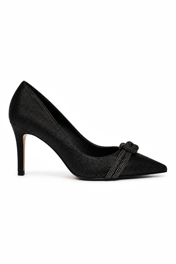 Velmora embellished pumps styled with a long black slit dress